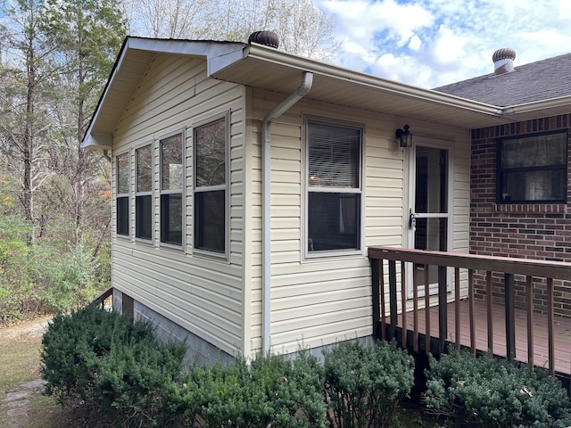 view of property exterior featuring a wooden deck