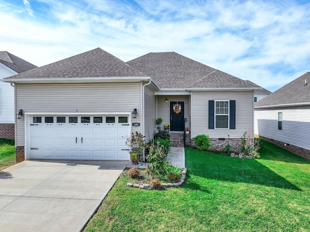 view of front of house with a garage and a front lawn