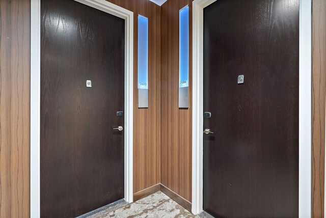 interior space featuring wood walls