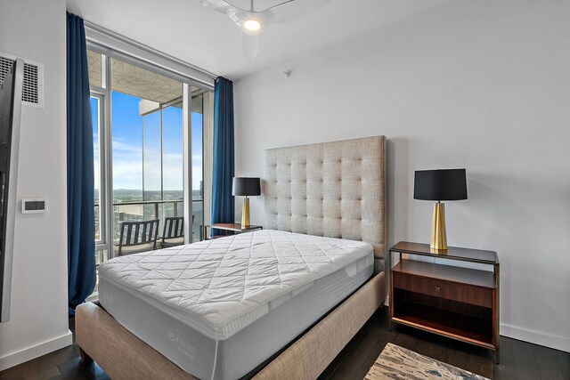 bedroom featuring access to outside, expansive windows, dark wood-type flooring, and ceiling fan