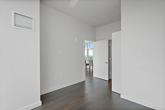 spare room with dark hardwood / wood-style floors