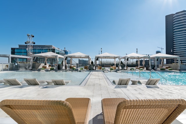 view of pool featuring a patio and a gazebo