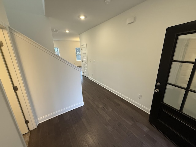 hall with dark wood-type flooring