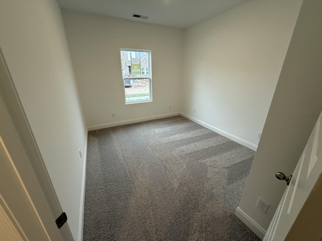 spare room featuring carpet floors