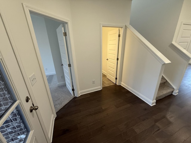 hall with dark hardwood / wood-style floors