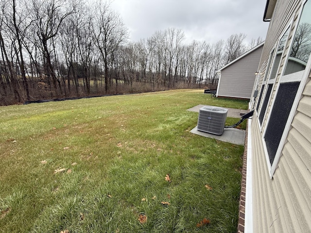 view of yard with central AC