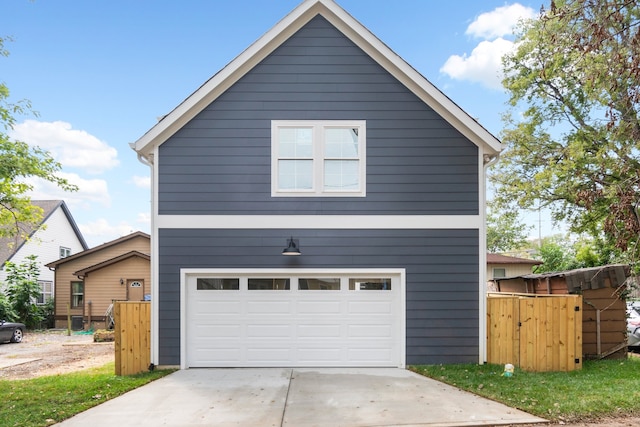 view of side of home featuring a garage