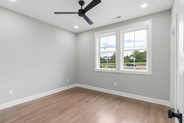 spare room with ceiling fan and light hardwood / wood-style floors