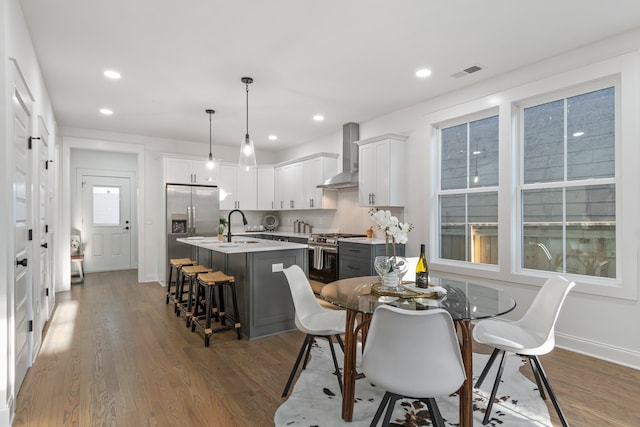 dining area with dark wood-type flooring and sink