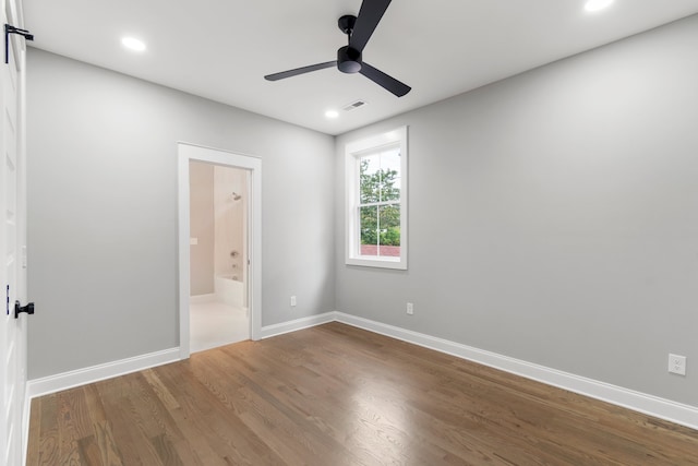 unfurnished room with hardwood / wood-style flooring and ceiling fan