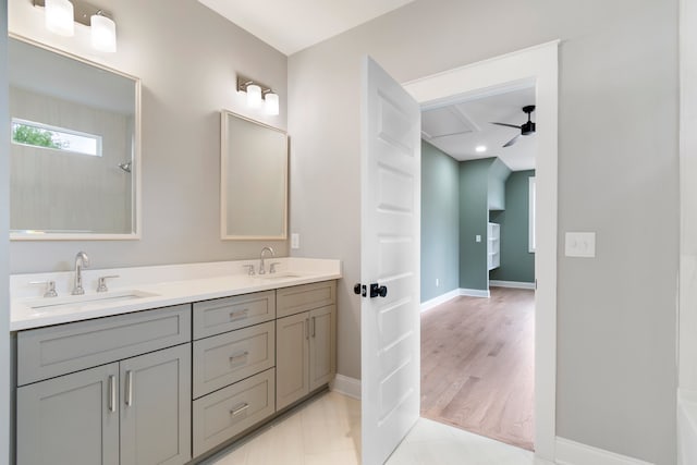 bathroom with ceiling fan, wood-type flooring, and vanity