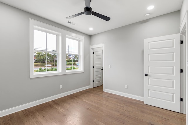 unfurnished bedroom featuring light wood-type flooring and ceiling fan