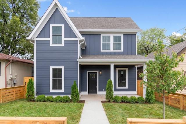 view of front of property with a porch and a front yard