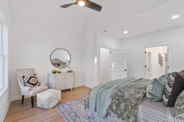 bedroom featuring ceiling fan, wood-type flooring, and lofted ceiling