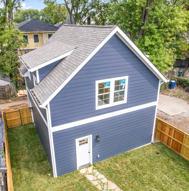 view of side of property with a yard