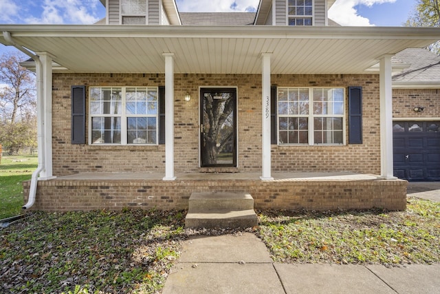 doorway to property featuring covered porch