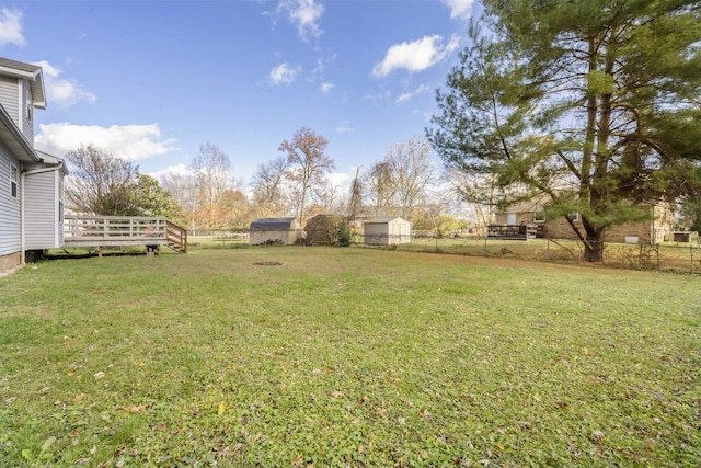 view of yard featuring a wooden deck