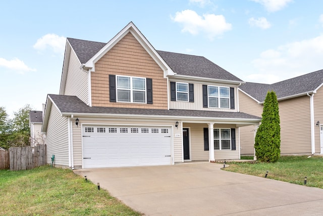 view of front of property with a garage and a front yard