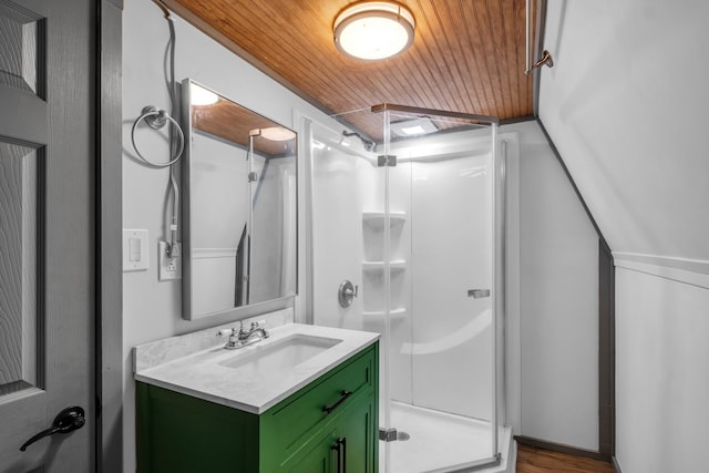 bathroom featuring vanity, hardwood / wood-style flooring, an enclosed shower, and wood ceiling