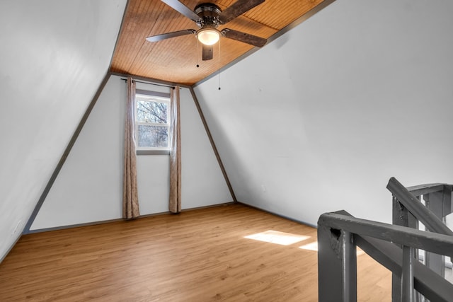 bonus room with ceiling fan, vaulted ceiling, wooden ceiling, and light hardwood / wood-style flooring