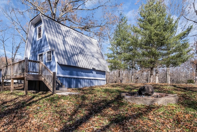 view of side of home with a deck