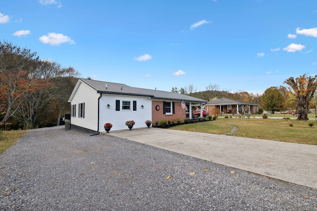 ranch-style house with a front lawn