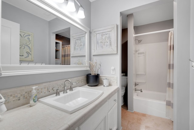 full bathroom featuring shower / bath combo with shower curtain, tile patterned floors, toilet, decorative backsplash, and vanity