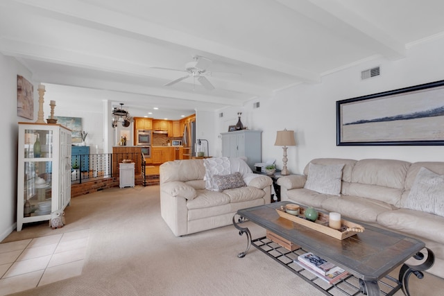 carpeted living room featuring ornamental molding, beamed ceiling, and ceiling fan