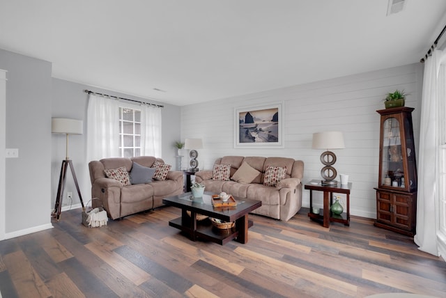 living room featuring dark hardwood / wood-style floors