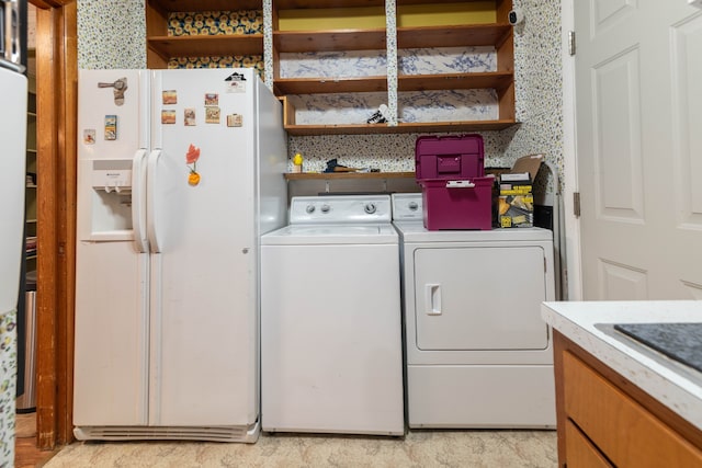 clothes washing area with washer and dryer