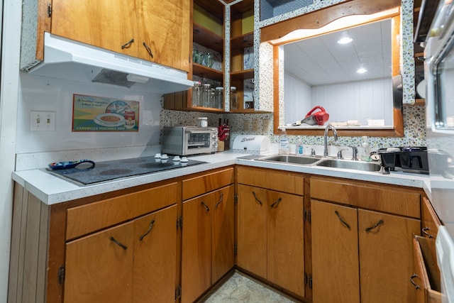 kitchen featuring stovetop and sink