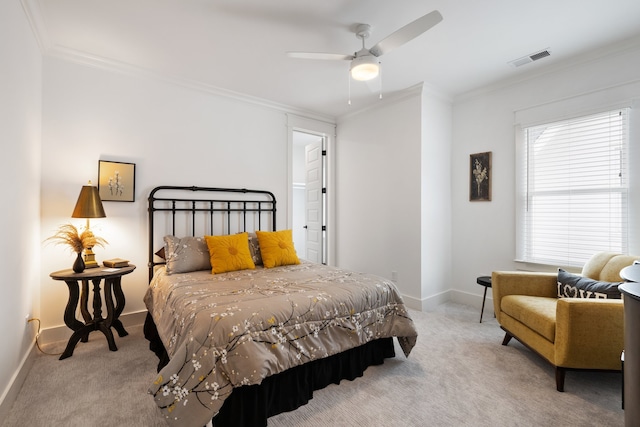 bedroom featuring light colored carpet, ceiling fan, and crown molding