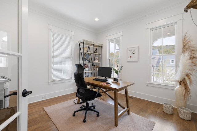 home office with ornamental molding and dark wood-type flooring