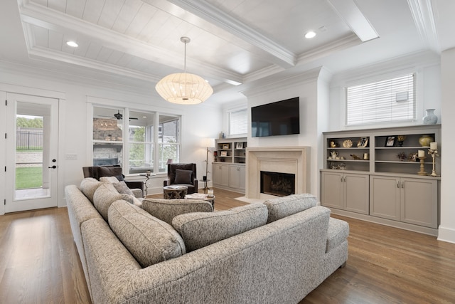 living room featuring ornamental molding, beamed ceiling, and dark hardwood / wood-style floors