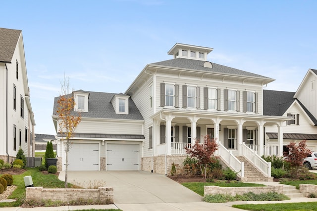 view of front of house featuring a garage and covered porch