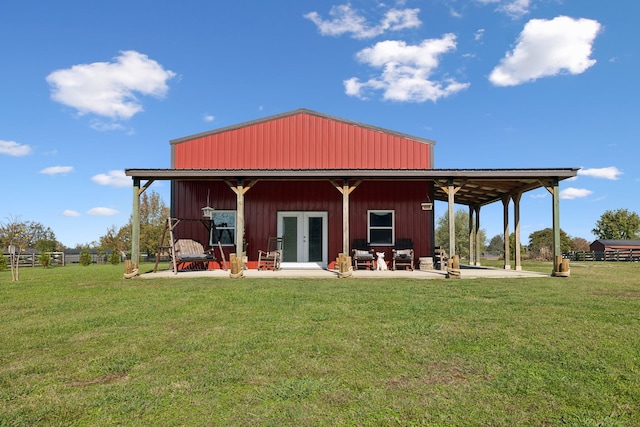 back of house with a patio, a yard, and french doors