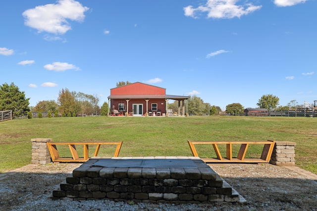 view of yard with a rural view