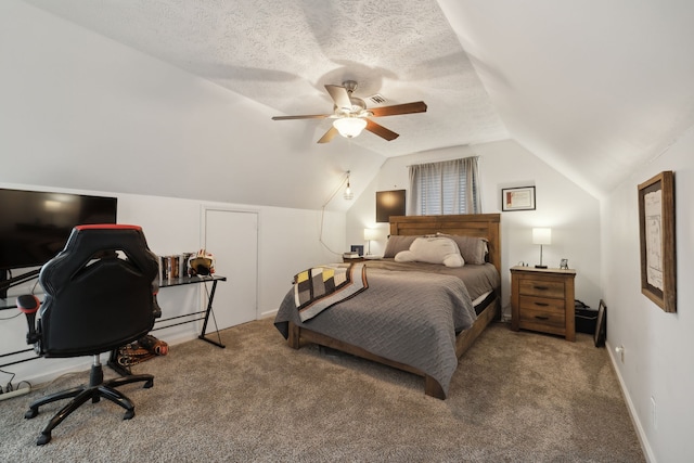 carpeted bedroom with ceiling fan, a textured ceiling, and lofted ceiling