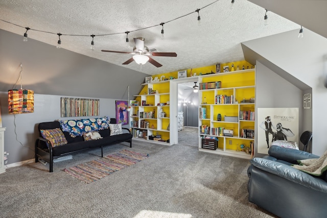 carpeted living room featuring lofted ceiling, a textured ceiling, and ceiling fan