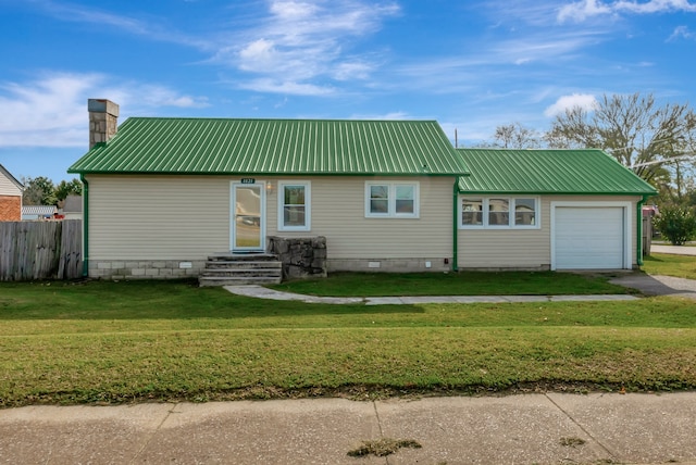 view of front of home featuring a garage and a front yard