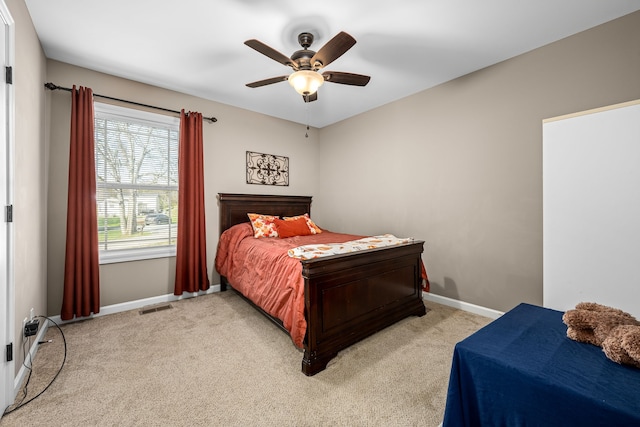 carpeted bedroom with ceiling fan