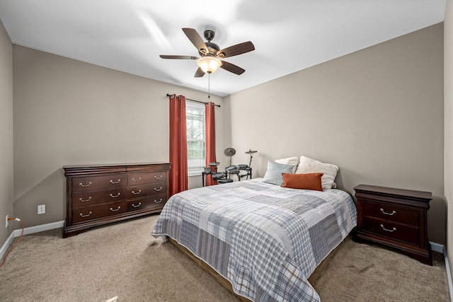 bedroom with ceiling fan and light carpet