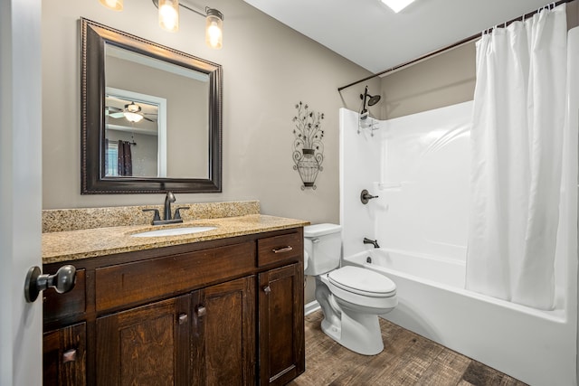 full bathroom with shower / bath combo, wood-type flooring, toilet, vanity, and ceiling fan