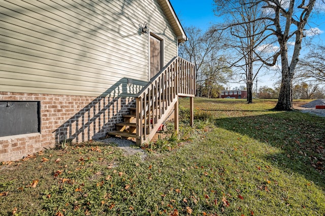 view of property exterior featuring a lawn