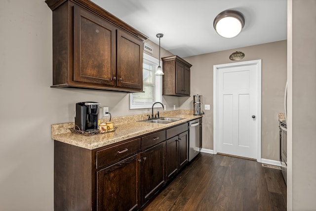 kitchen featuring sink, decorative light fixtures, stainless steel dishwasher, dark brown cabinets, and dark hardwood / wood-style flooring