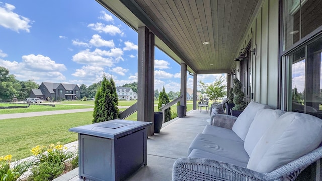 view of patio / terrace with covered porch and a residential view