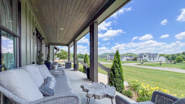 view of patio / terrace featuring a porch, a residential view, and outdoor lounge area