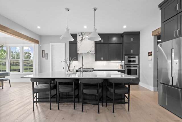 5124 Bond Mill Rd, Thompsons Station, TN 37179 - kitchen featuring appliances with stainless steel finishes, baseboards, light countertops, and recessed lighting