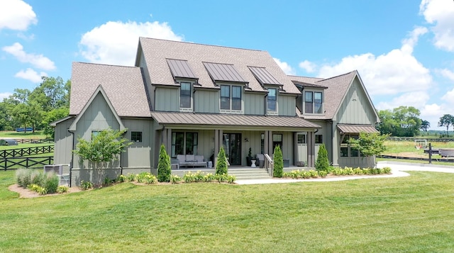 5124 Bond Mill Rd, Thompsons Station, TN 37179 - modern inspired farmhouse with a standing seam roof, board and batten siding, a porch, and metal roof