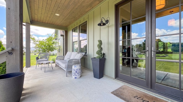 exterior space with a sunroom and french doors